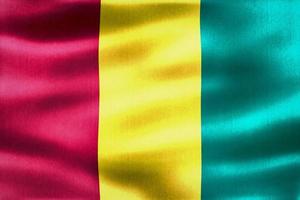 Guinea-Flagge - realistische wehende Stoffflagge foto