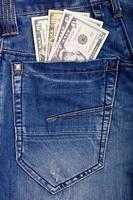 Dollar im Blau Jeans Tasche foto