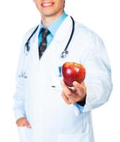 Arzt halten rot Apfel auf Weiß Nahansicht foto