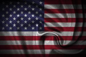 ein Nahansicht von gekräuselt amerikanisch Flagge, wellig Baumwolle Flagge von Amerika foto