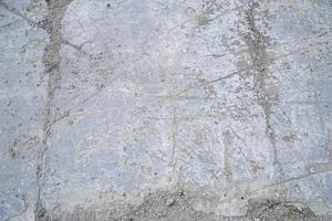 grau Beton Oberfläche mit viele Kratzer foto