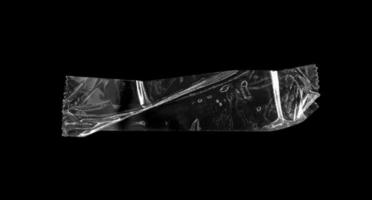 selbstklebendes Kunststoffband auf schwarzem Hintergrund isoliert foto