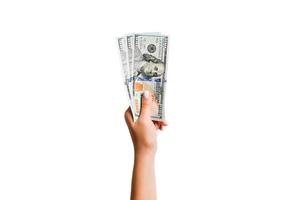 oben Aussicht von Dollar Banknoten im weiblich Hand auf Weiß isoliert Hintergrund. Geschäft Konzept foto
