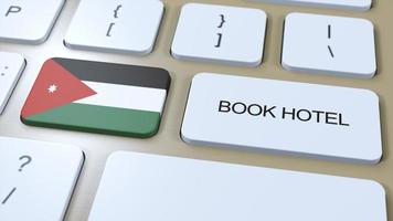 Buch Hotel im Jordan mit Webseite online. Taste auf Computer Klaviatur. Reise Konzept 3d Animation. Buch Hotel Text und National Flagge. 3d Illustration foto