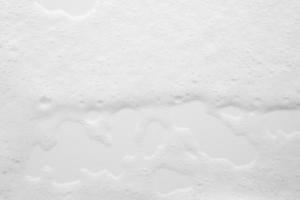 abstrakt Weiß Seife Schaum Luftblasen Textur auf Weiß Hintergrund foto
