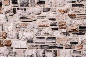 schließen oben von ein Stein Mauer foto