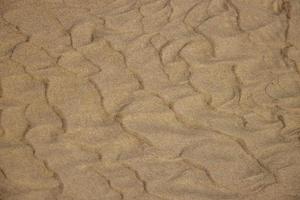 Original Hintergrund von golden Sand auf das Strand foto