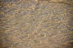 Original Hintergrund von golden Sand auf das Strand foto