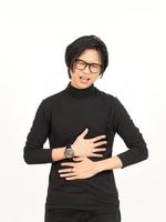 Leiden Magenschmerzen Geste von gut aussehend asiatisch Mann isoliert auf Weiß Hintergrund foto