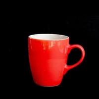 rot Becher. rot Tasse zum Tee oder Kaffee auf Hintergrund. foto
