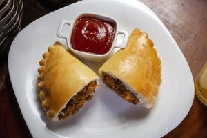 Empanadas, Gebäck ausgestopft Essen foto