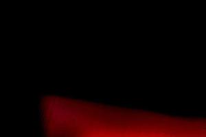 leer gemasert und zerkratzt Film Streifen Textur Hintergrund mit schwer Getreide, Staub und ein Licht Leck echt Linse Fackel Schuss im Studio Über schwarz Hintergrund foto