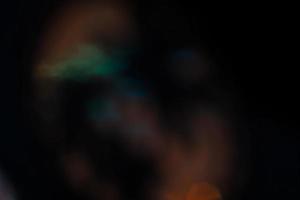 Linse Fackel und Licht Leck Dunst Textur auf ein schwarz Hintergrund. foto