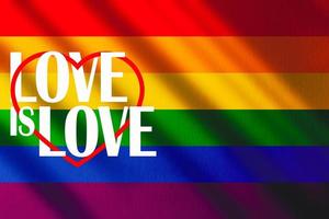 das Fröhlich Stolz Regenbogen Flagge mit Schatten und das Wörter, Liebe ist Liebe. Fröhlich Stolz Bewegung. foto