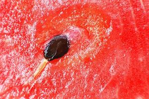 Scheibe von Wassermelone Nahansicht. Wassermelone Samen Makro. Wassermelone Hintergrund foto