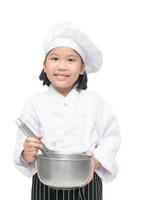 süß asiatisch Mädchen Koch halten Schneebesen mit Schüssel ein foto