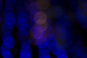 bunt defokussieren abstrakt Bokeh Licht Auswirkungen auf das Straße Nacht schwarz Hintergrund Textur Hintergrund foto