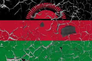 3d Flagge von Malawi auf ein alt Stein Mauer Hintergrund. foto