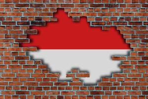 3d Flagge von Indonesien hinter das gebrochen alt Stein Mauer Hintergrund. foto