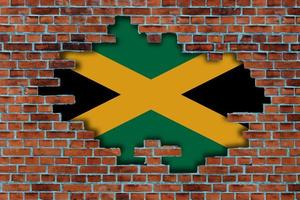 3d Flagge von Jamaika hinter das gebrochen alt Stein Mauer Hintergrund. foto