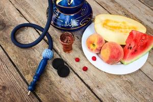 Huka, Frucht, Beeren auf alt hölzern Hintergrund. foto