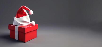 Weihnachten rot Geschenk Box mit Band und Santa claus Hut auf grau Hintergrund, isolieren. ai generiert. foto