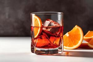 auf ein Weiß Hintergrund ein Negroni Cocktail im ein Kristall Glas mit Eis Würfel und ein Orange Scheibe. ai generiert foto