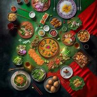 oben Aussicht von Tabelle Abendessen Vietnamesisch. Knolling Fotografie von Familie Abendessen Neu Jahr , beschwingt. Vietnamesisch traditionell Mahlzeit im Land Seite. eben legen. foto
