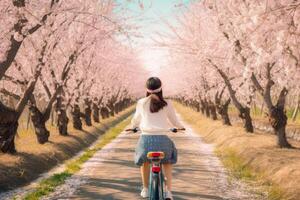 Mädchen Fahrten Fahrrad im Sakura Park. Illustration ai generativ foto
