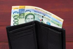 Philippinen Geld - - Peso im das schwarz Brieftasche foto