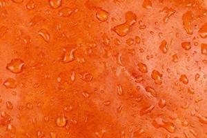 Nahaufnahme abstrakter strukturierter Hintergrund eines orange Kürbises