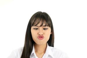 Gesichts- Ausdruck jung asiatisch Frau Büro Kleidung Weiß Hintergrund Kuss Kreuz Auge foto