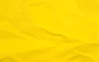 lebendige bunte zerknitterte zerknitterte Ringelblume gelber leerer Papierbeschaffenheit abstrakter Hintergrund foto