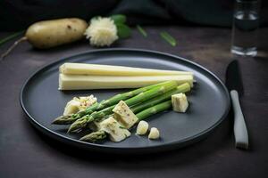 traditionell bayerisch Weiß Spargel serviert mit wild Knoblauch und Mandel Butter Nahansicht auf ein nordisch Design Teller mit Kopieren Raum, generieren ai foto