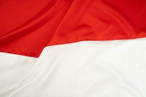 wellig indonesisch National Flagge Hintergrund foto