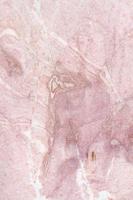 Natursteinhintergrundbeschaffenheit mit rosa und Grautönen foto