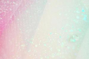 Ein wunderschönes und elegantes Makro aus Glitzer aus funkelnden Diamanten mit Bokeh oder Tiefenschärfe und rosa Textur als Hintergrund foto