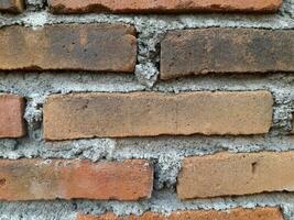 schließen oben von ein Backstein Mauer. foto