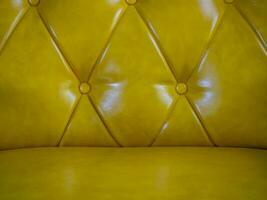 Textur Gelb Samt Muster Hintergrund Textil- Jahrgang Chesterfield Stil Sanft kariert Weberei Möbel Nahansicht Muster foto
