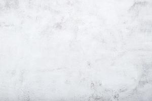 Hintergrund des alten gealterten rauen weißen gemalten Betons mit Fleckenbeschaffenheit foto