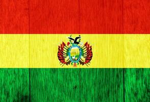 Flagge von Bolivien auf ein texturiert Hintergrund. Konzept Collage. foto