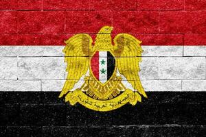 Flagge von syrisch arabisch Republik auf ein texturiert Hintergrund. Konzept Collage. foto