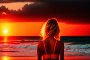 Sonnenuntergang Strand mit rot Himmel und Mädchen zurück foto
