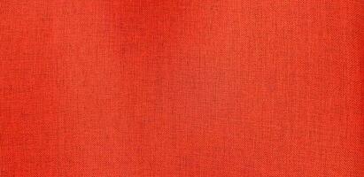 rot Leder Baumwolle oder Stoff Stuhl zum Hintergrund. schließen oben Oberfläche von Material und texturiert Hintergrund. foto