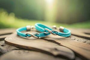 ein schließen oben fotografieren von ein Paar Blau Armband Bildung ein Unendlichkeit Symbol auf ein rustikal Holz mit Bokeh Hintergrund foto