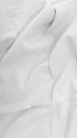 organisch Stoff Baumwolle Hintergrund Weiß Leinen- Segeltuch zerknittert natürlich Baumwolle Stoff natürlich handgemacht Leinen- oben Aussicht Hintergrund organisch Öko Textilien Weiß Stoff Leinen- Textur foto