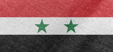 Syrien Flagge Stoff Baumwolle Material breit Flagge Hintergrund foto