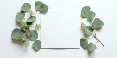 minimalistisch Gruß Karte Attrappe, Lehrmodell, Simulation mit zart trocken Eukalyptus Blätter - - oben Aussicht auf ein sauber Weiß Hintergrund, ai generiert foto