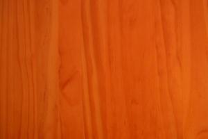 oranger Hintergrund aus Kirschholz foto