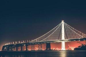 Oakland Bucht Brücke beim Nacht foto